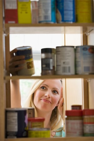 Picture of woman looking into cabinet