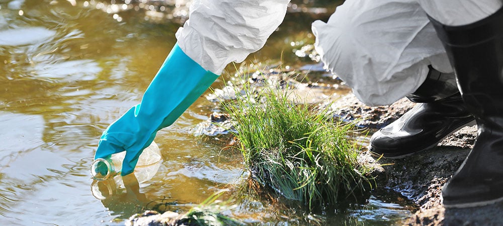 Person collecting water sample