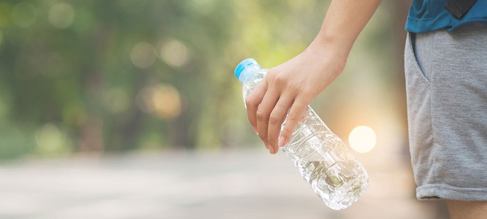 Person holding bottled water
